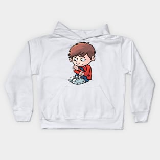 sad and depressed boy sits curled up on the ground Kids Hoodie
